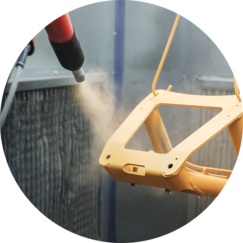 Applying powder coat to a bumper at Forest Powder